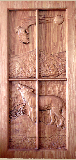 Carved door of Wolf standing on a rock howling at the moon over a lake with an Eagle soaring overhead